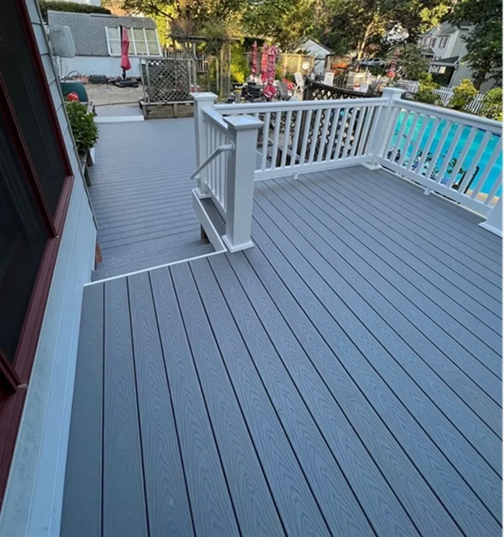 Modern gray composite deck with white railings