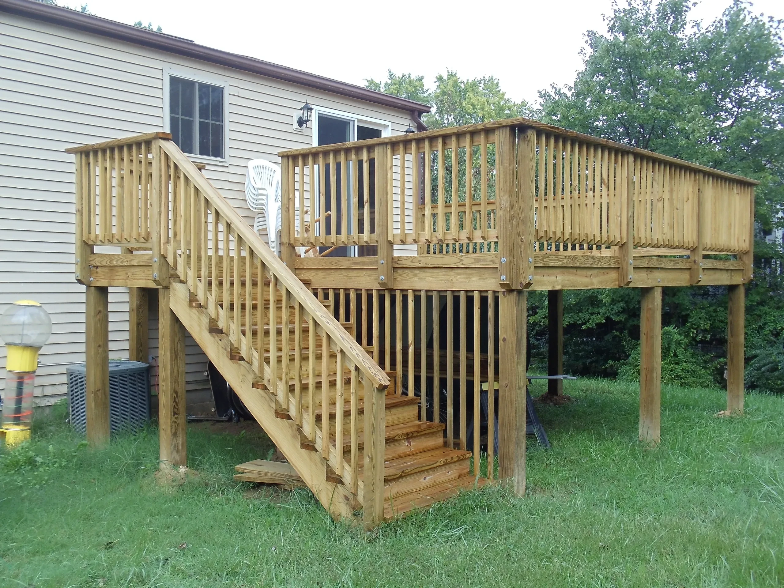 Wooden deck with stairs and railings