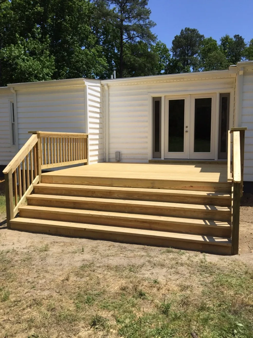 Wooden deck with railing mobile home