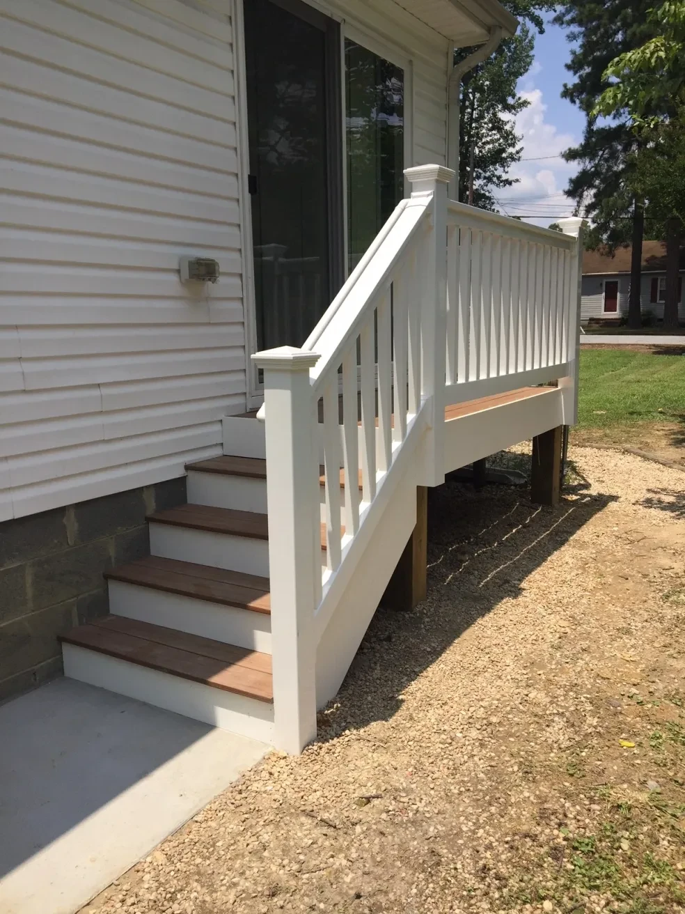 White deck stairs residential home exterior