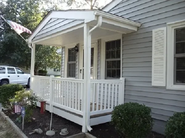 White porch with railing suburban home