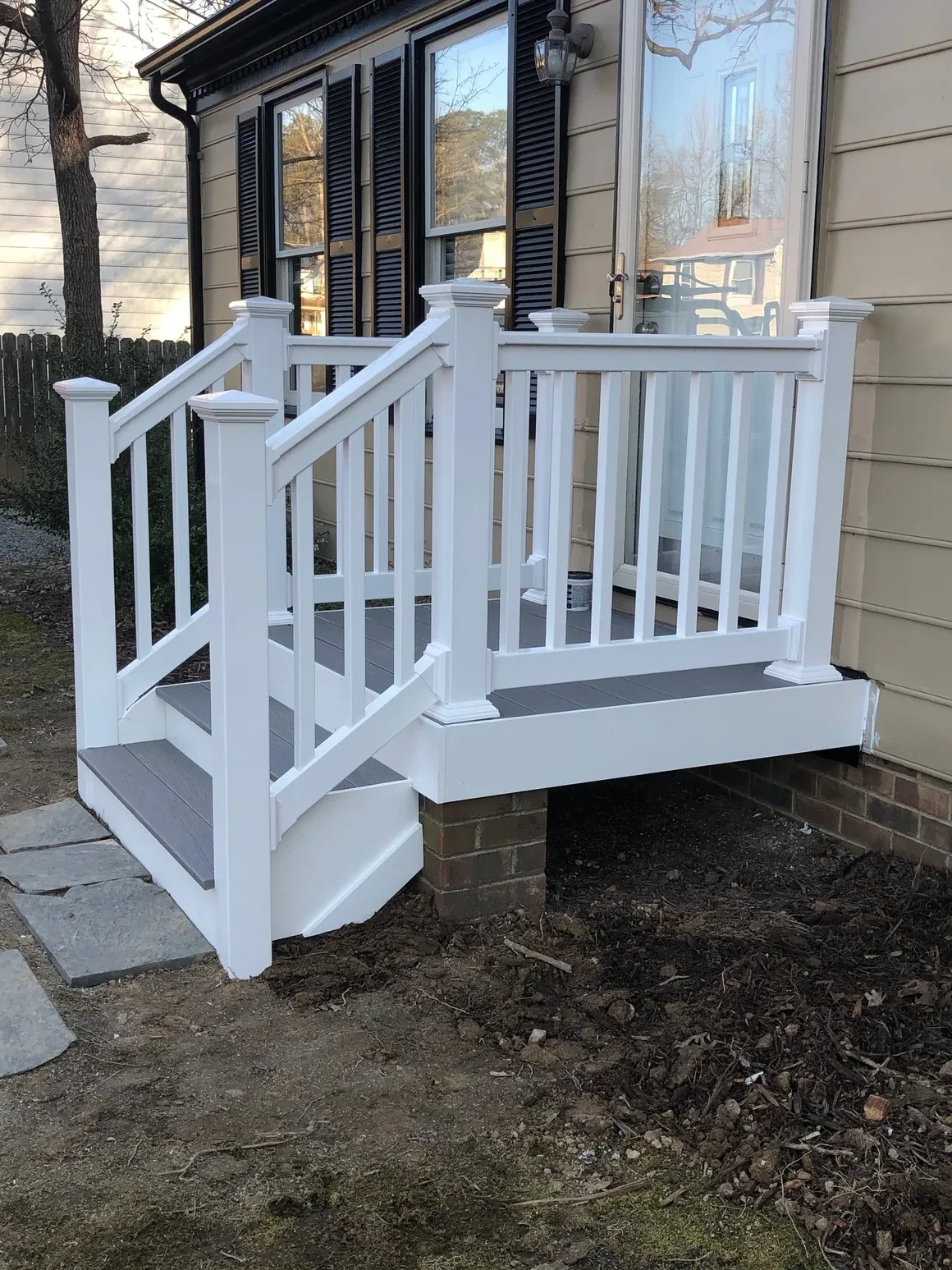 White porch railing modern home entrance