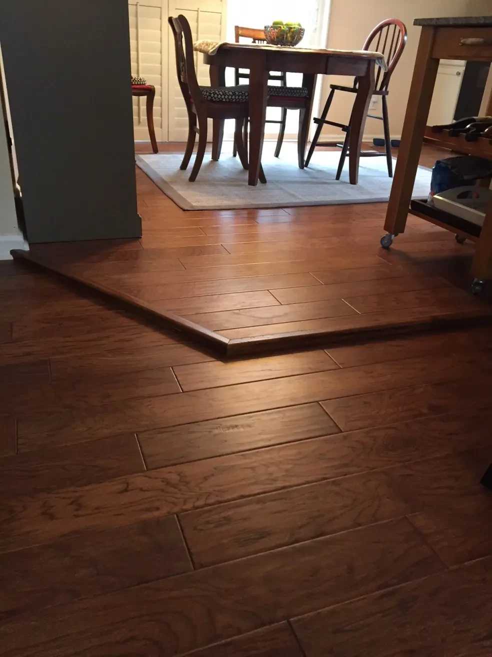 Dining room with wood flooring and furniture