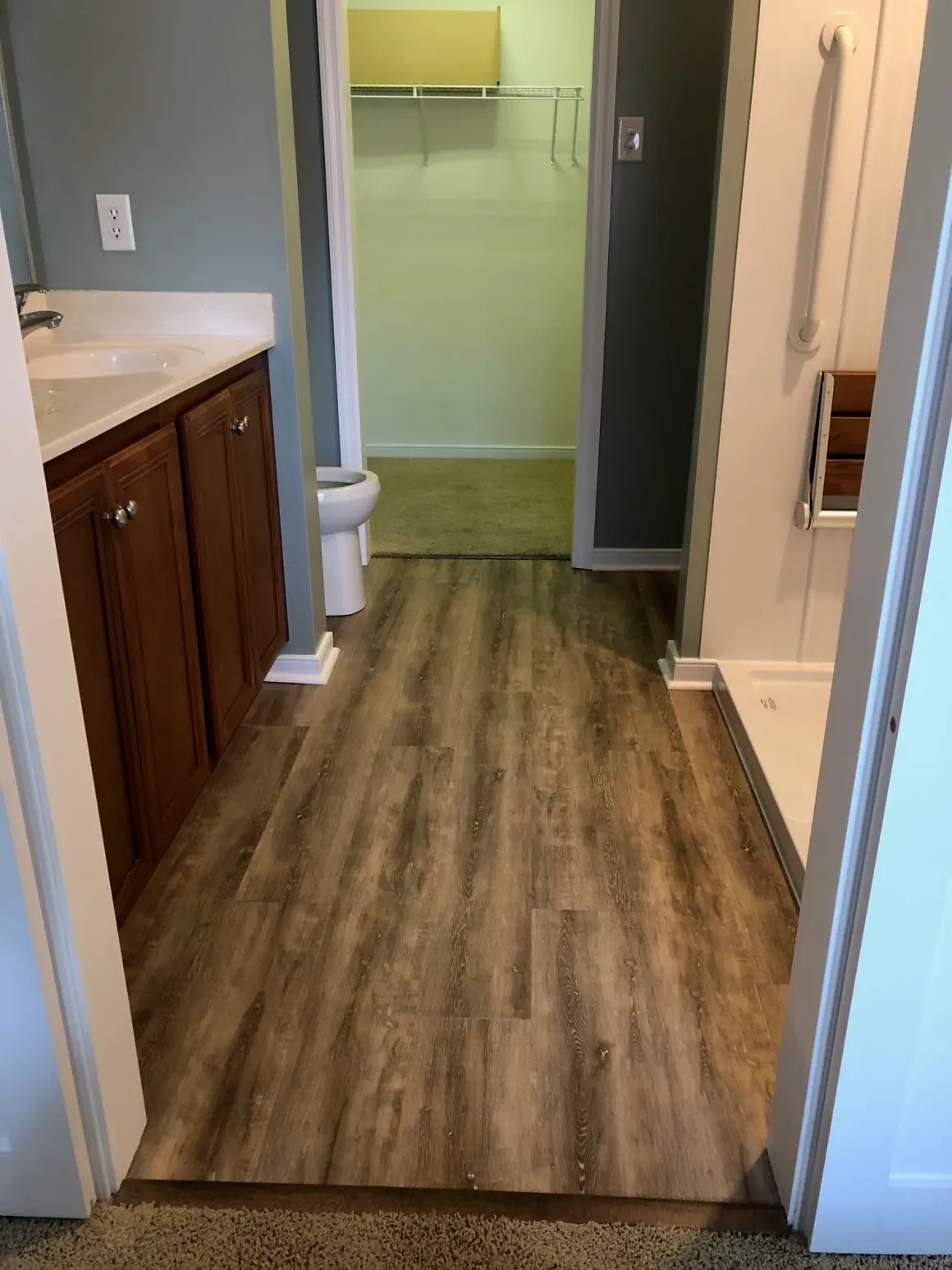 Modern bathroom with wood flooring shower