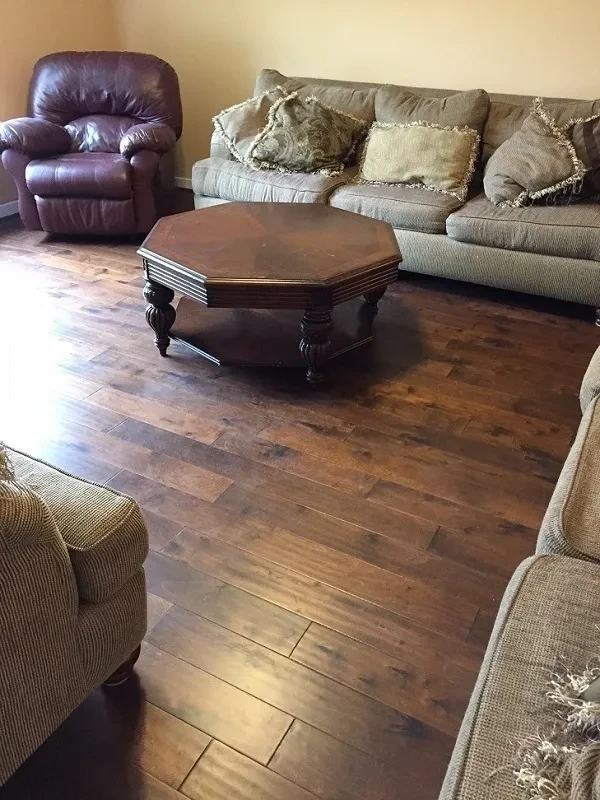 Living room with upholstered furniture and wooden floors