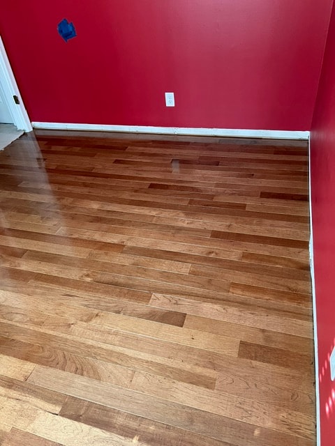 Empty room red wall wooden floor