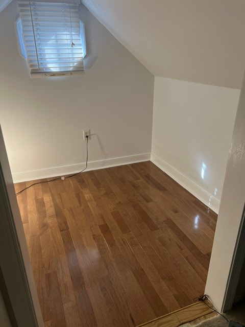 Empty attic room wooden floors skylight
