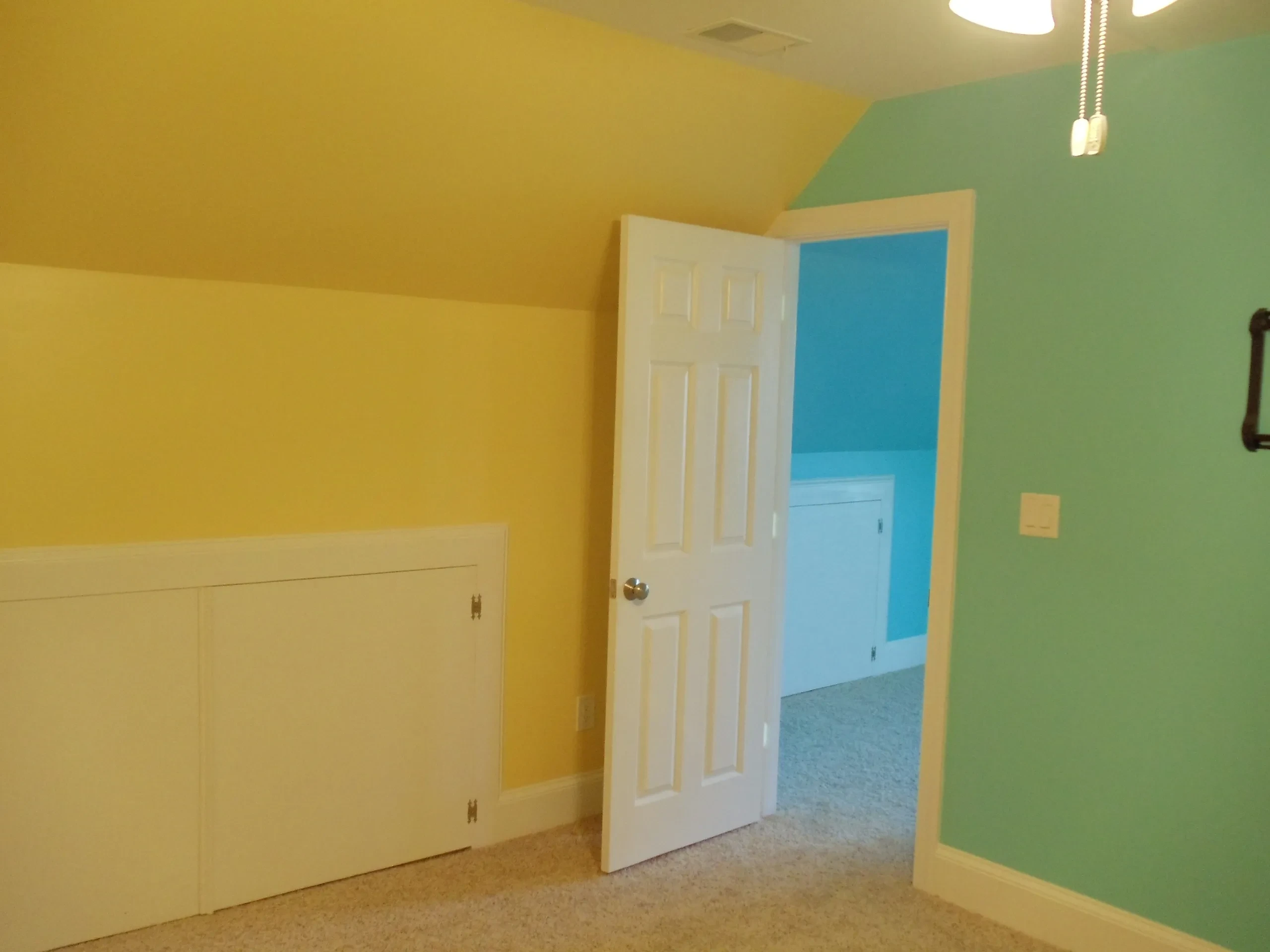 Colorful children's bedroom with yellow green walls