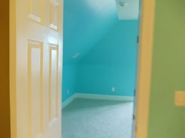 Colorful hallway with turquoise and yellow walls