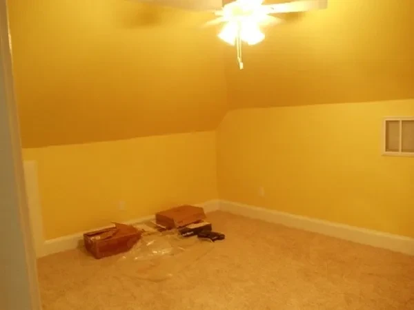 Empty room yellow walls storage boxes