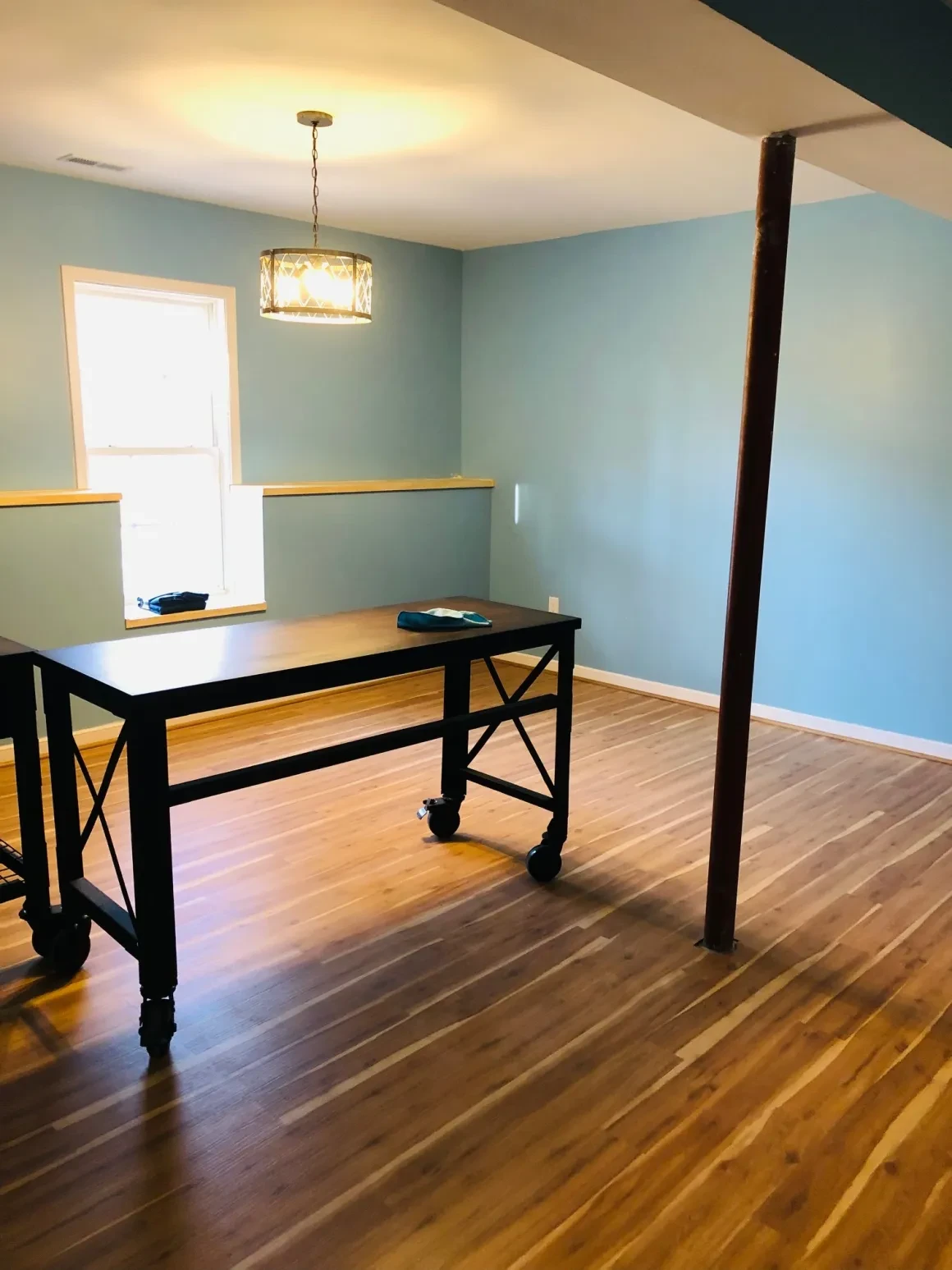 Modern office space with blue walls and wooden floors