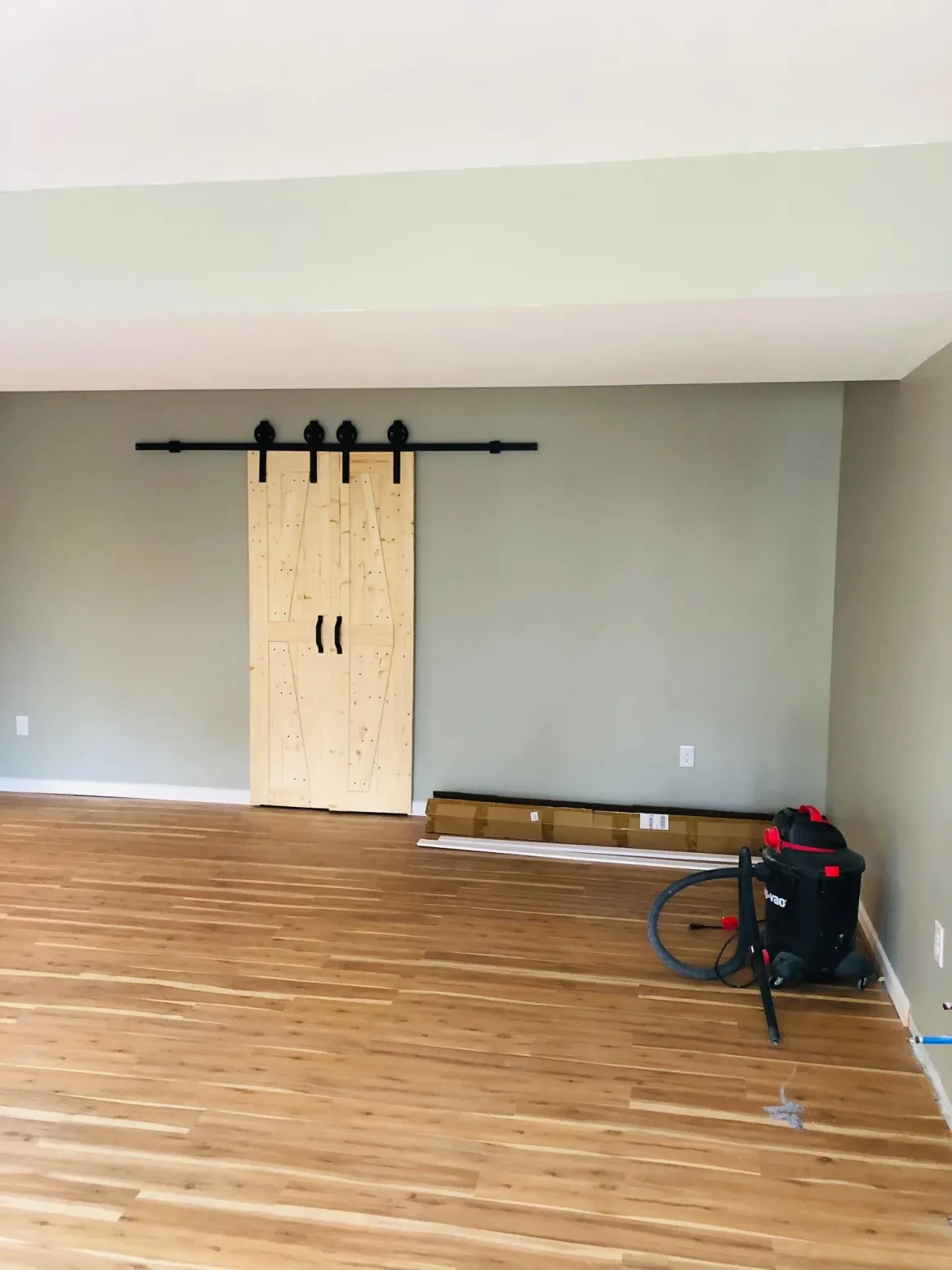Barn door sliding on black track interior