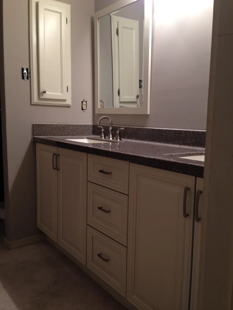 Modern bathroom vanity with dark countertop