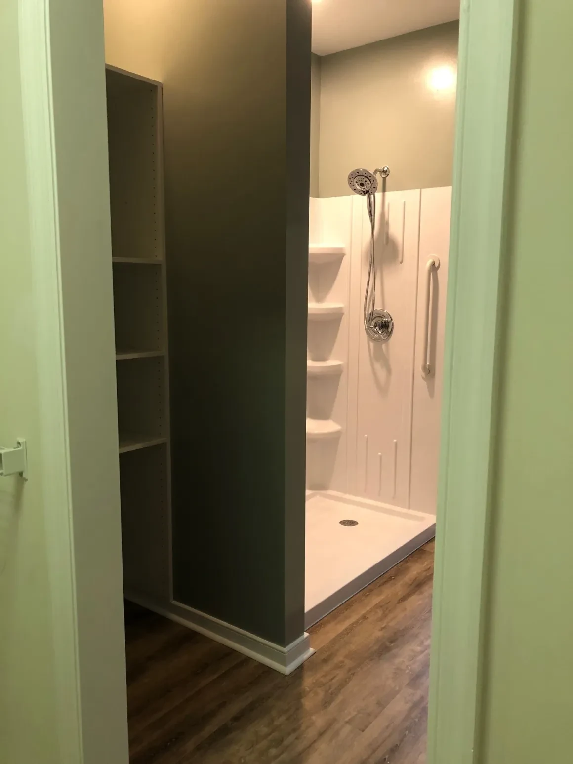 Modern bathroom shower with built-in shelving