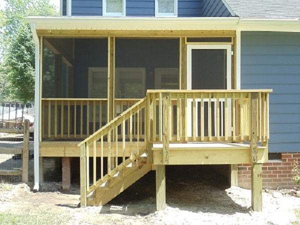 Wooden deck with screened porch addition