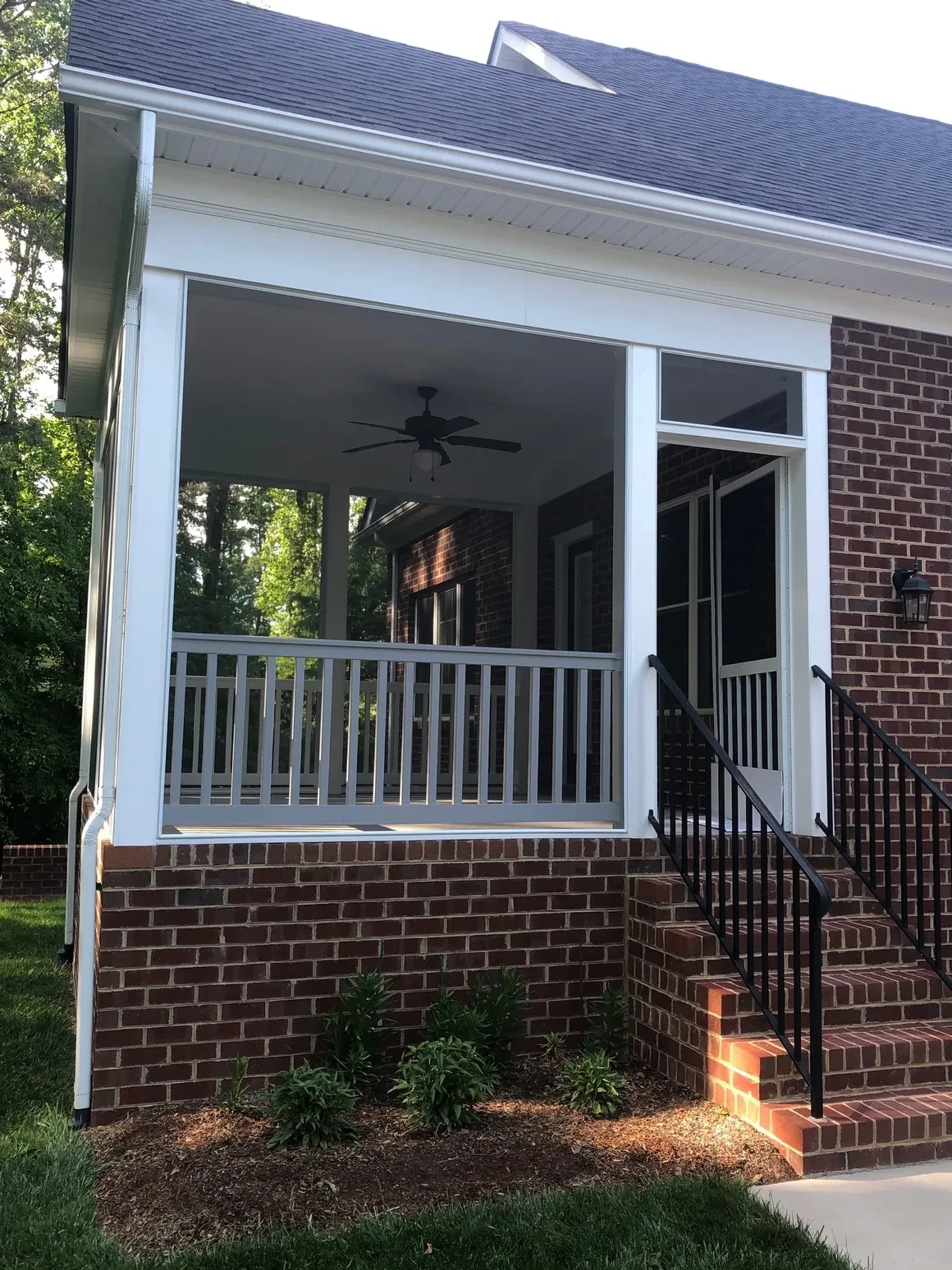Modern brick house screened porch addition