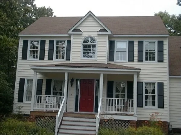 Two story colonial house red door siding renovation
