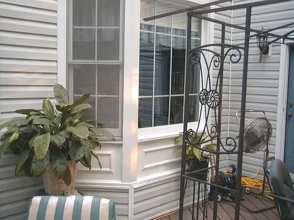 Patio with potted plant and metal arbor