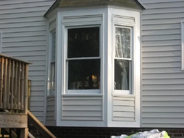 White enclosed porch addition house exterior