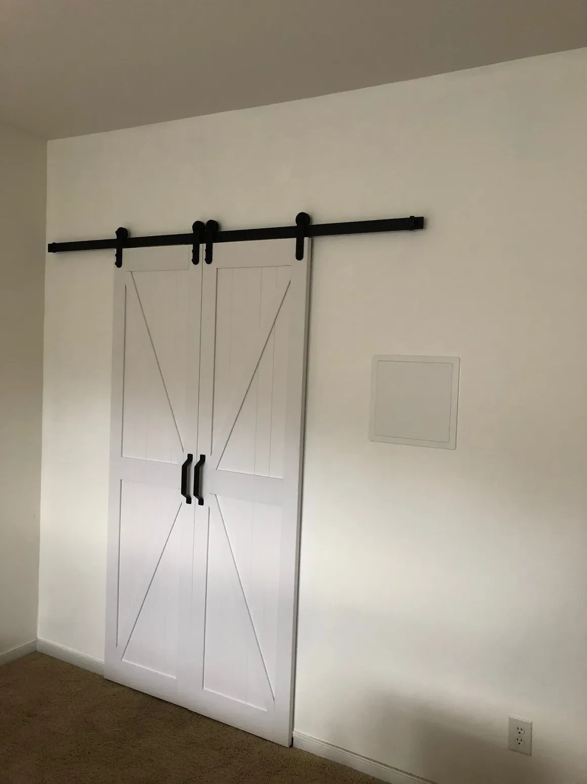 White barn doors sliding black track