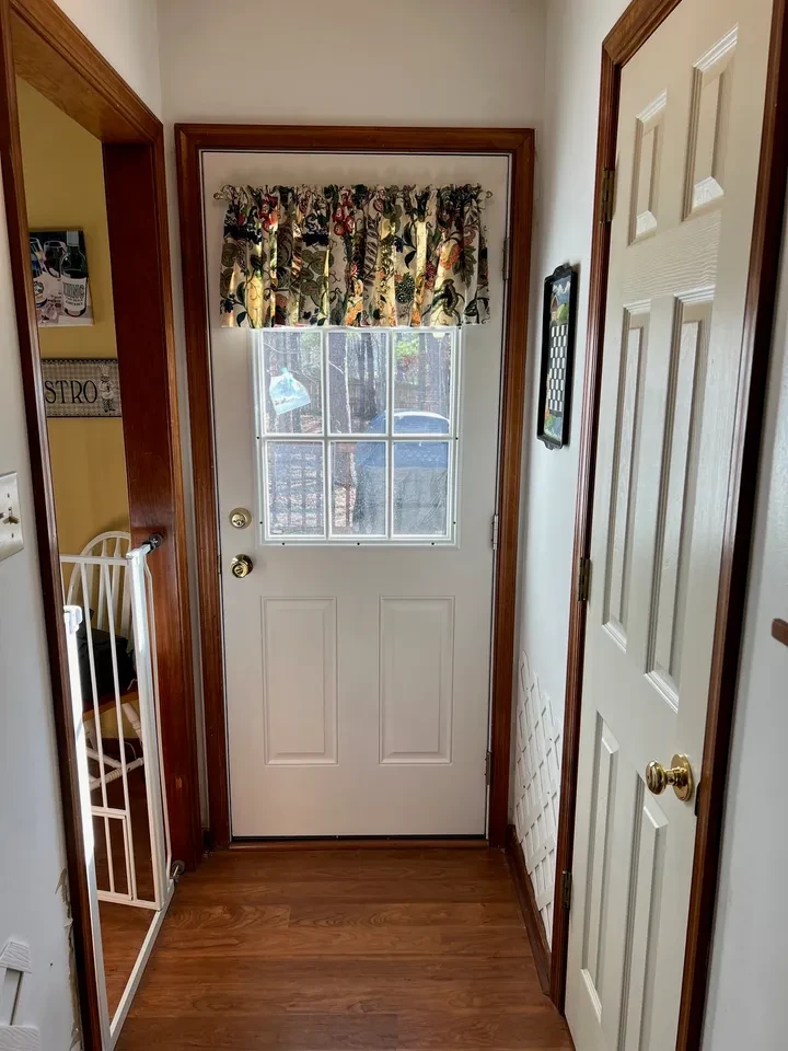 Home entryway with glass door and windows