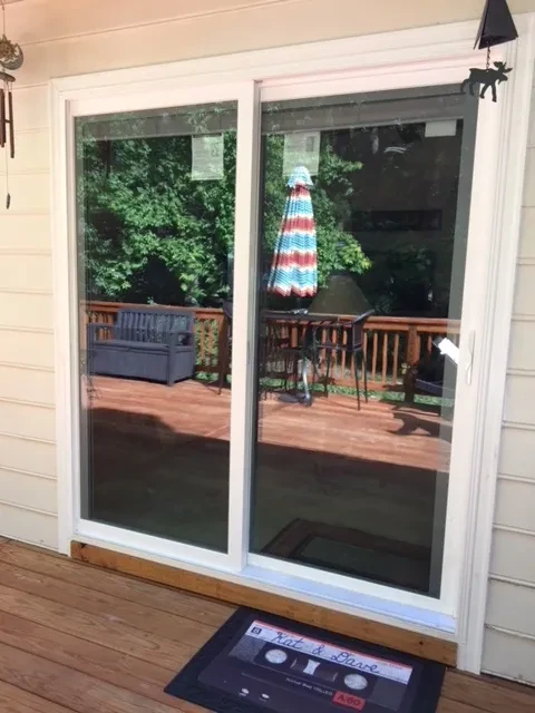 Sliding glass doors opening to wooden deck